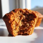 Close-up showing the moist, crumbly interior texture of a freshly baked bran muffin.