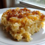 A close-up serving of creamy french onion butter rice topped with deeply caramelized onions.